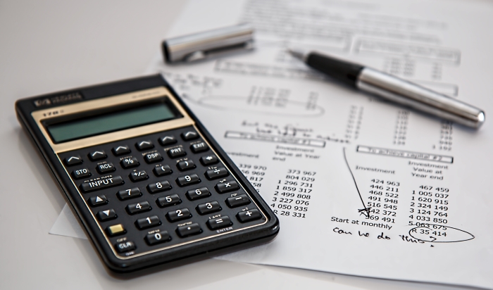 Calculator and notes working out mortgage payments