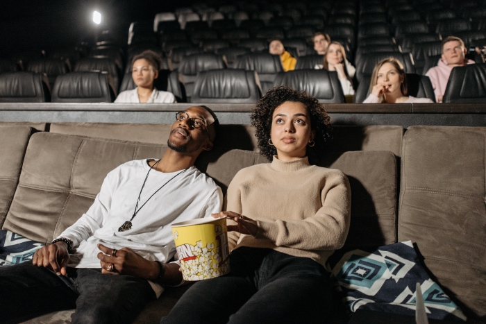 Couple watching a film at the cinema
