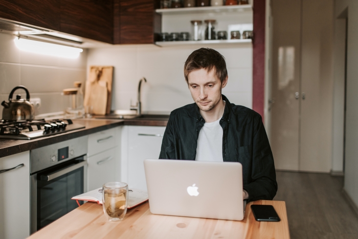 Man using laptop to work from home