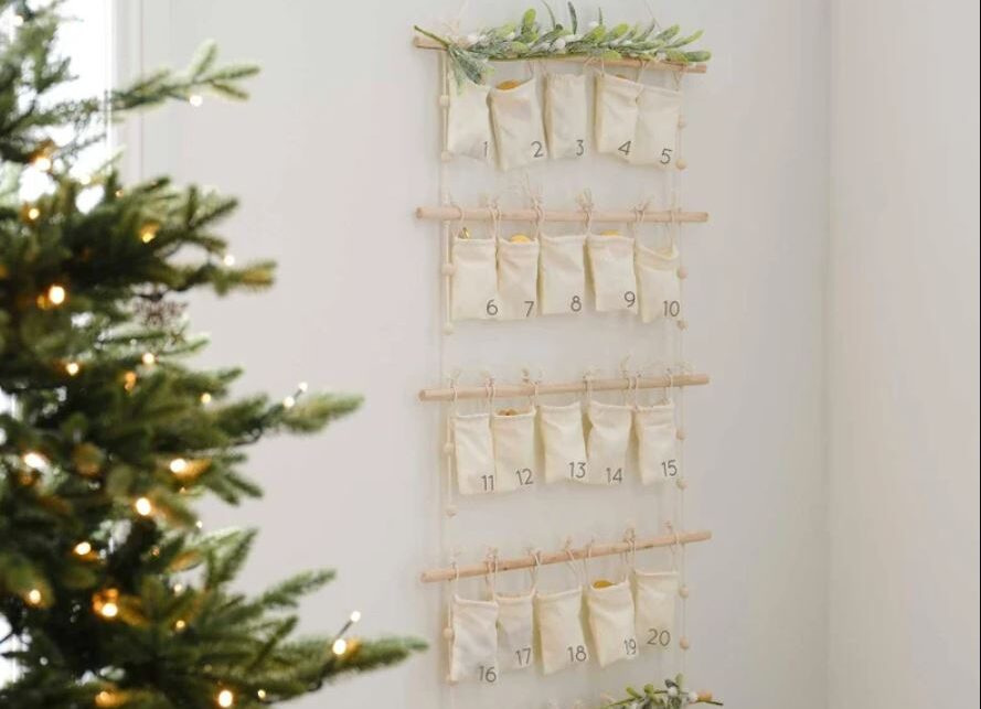 A sustainable christmas advent calendar hanging on a wall 