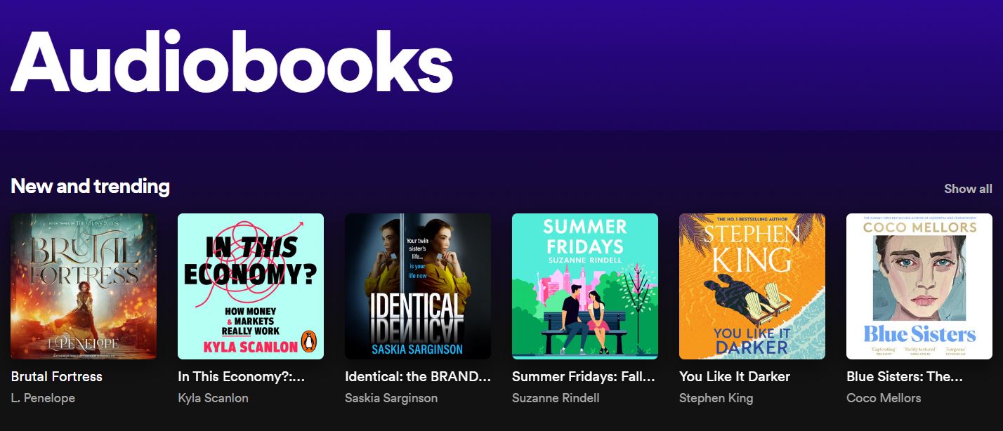 Spotify's audiobook collections "New and trending" displaying six audiobook covers: Brutal Fortress, In This Economy?!, Identical, Summer Fridays, You Like It Darker, and Blue Sisters. 