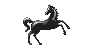 A silhouette of a rearing black horse on a white background.