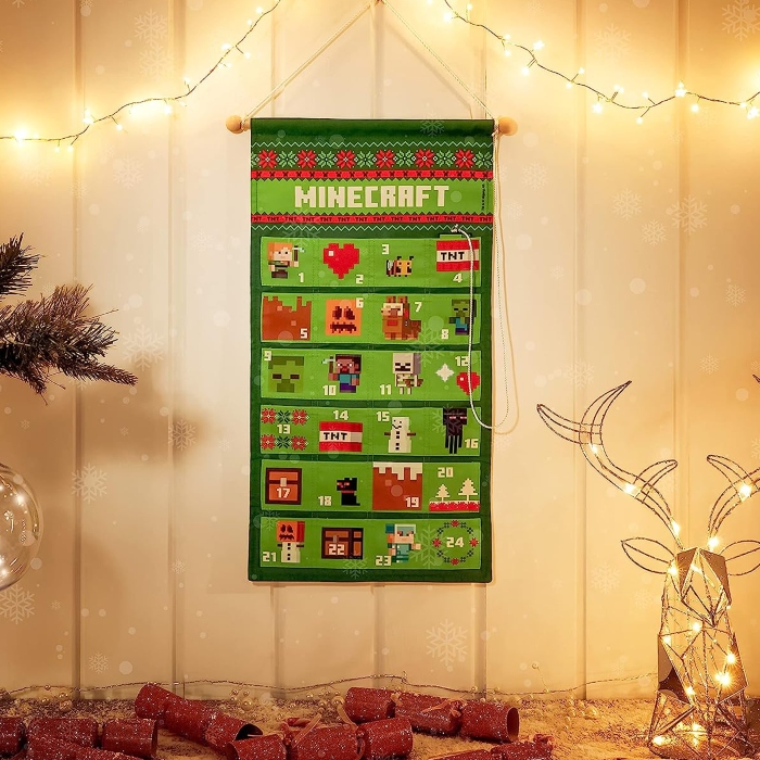 An image showing a green Minecraft-themed DIY advent calendar with 24 doors