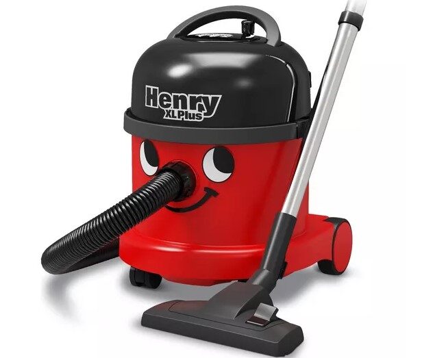 Red and black canister vacuum cleaner with a smiling face design, labeled "Henry XL Plus.