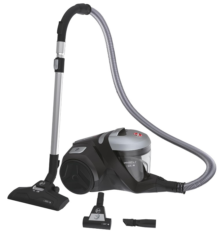 A black and silver canister vacuum cleaner with a flexible hose, main floor attachment, and two additional nozzle attachments.