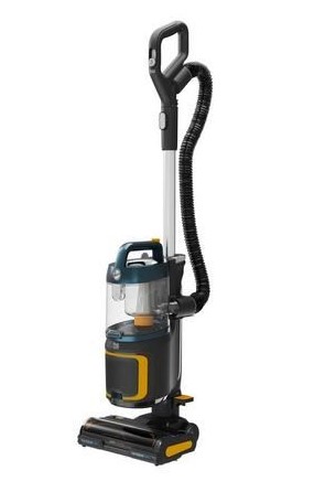 A black and yellow upright vacuum cleaner with a transparent dustbin and a hose attachment.