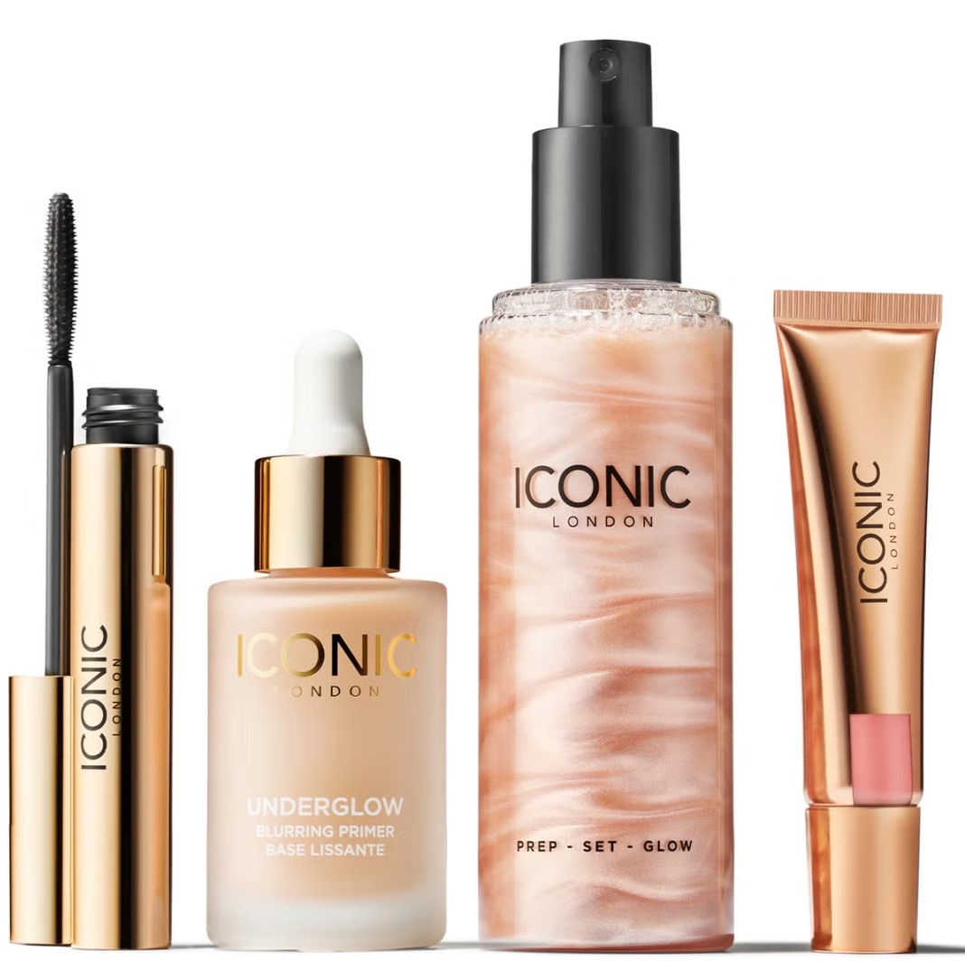 A set of Iconic London makeup products including mascara, primer, setting spray, and lip gloss.