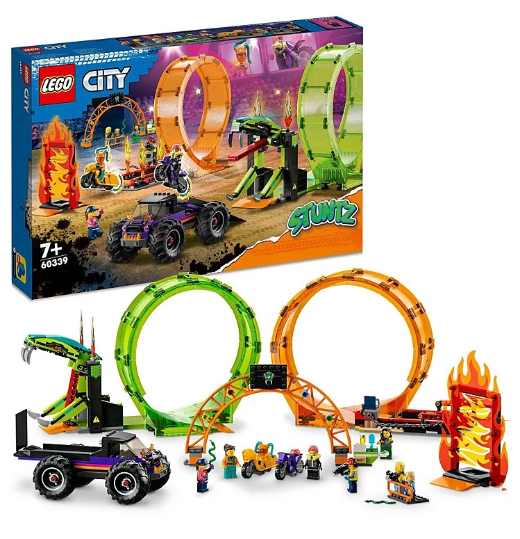 LEGO City Stuntz set featuring a snake loop, ramp, fiery hoop, vehicles, and mini-figures. Box packaging displays the assembled set with vibrant colors and action scenes.