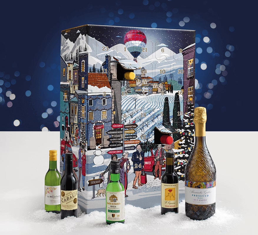 An image of bottles surrounding a Christmas scene, showing a wine advent calendar