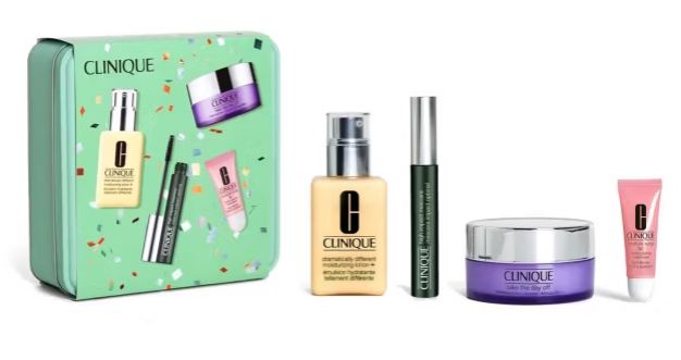 Clinique gift set with five skincare products, including a moisturizing lotion, mascara, eye cream, lip balm, and night cream, displayed next to a festive green box.