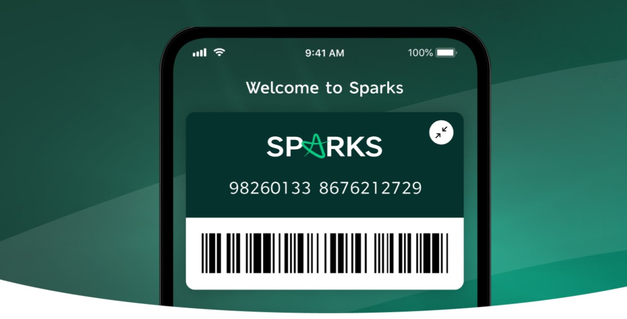 A smartphone screen displays the Sparks app, featuring a membership card with the number 98260133 8676212729 and a barcode below it.