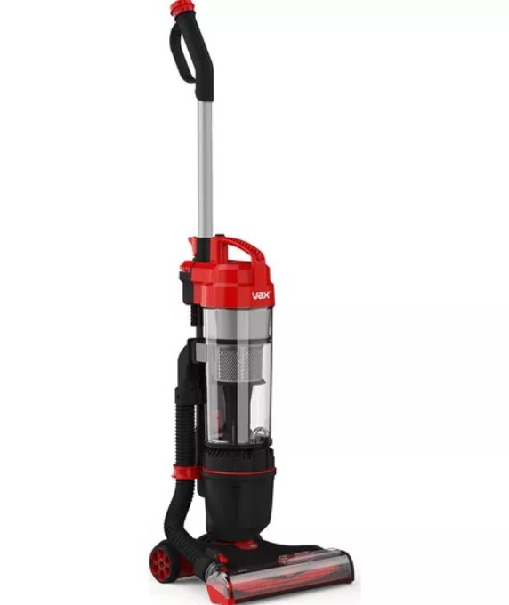 Red and black upright vacuum cleaner with a cylindrical dust container and hose attachment.