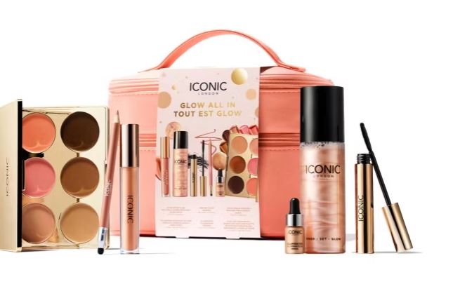 Makeup set including a palette, sprays, lip gloss, mascara, and a makeup bag, labeled "Iconic London Glow All In".