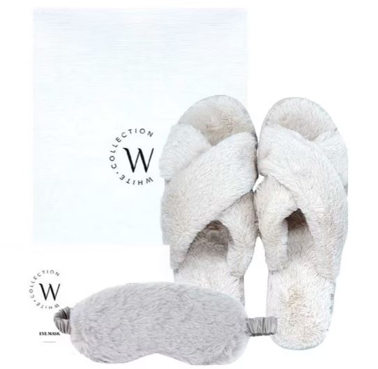 Gray fuzzy slippers and a matching eye mask are displayed against a white background with "W Collection White" text.