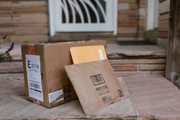 An image showing Vinted delivery parcels outside a customer's front door