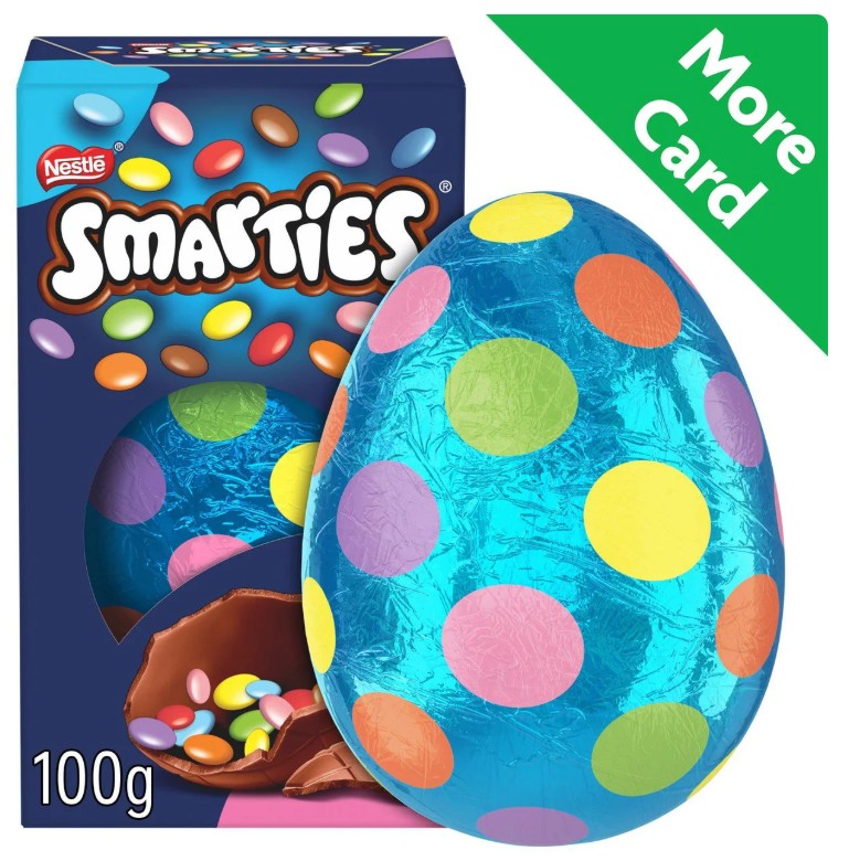 Smarties Easter egg packaging featuring a foil-wrapped chocolate egg with colorful polka dots beside the box.